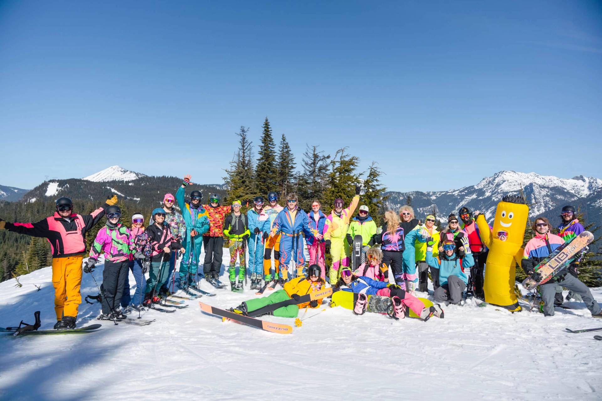 group photo dressed in neon at top of Summit East