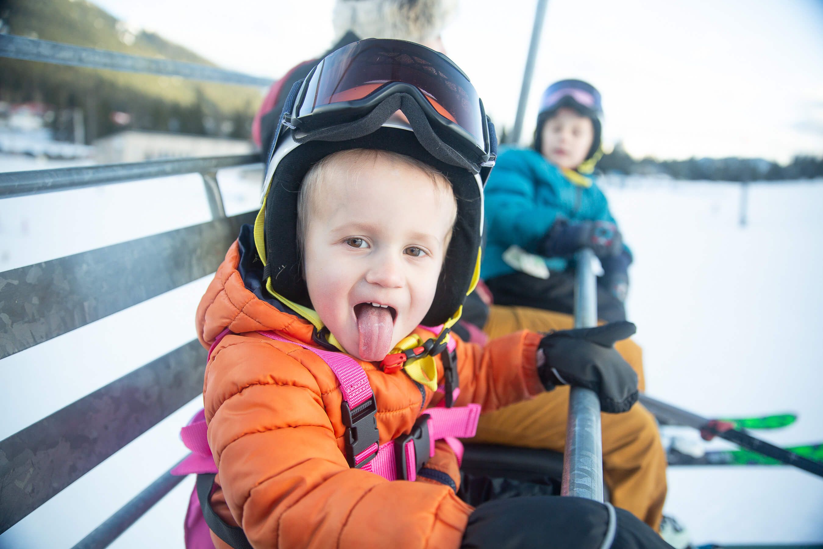 child smiling on chairlift