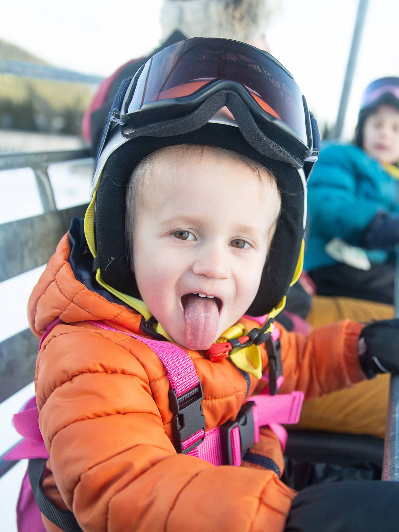 child smiling on chairlift