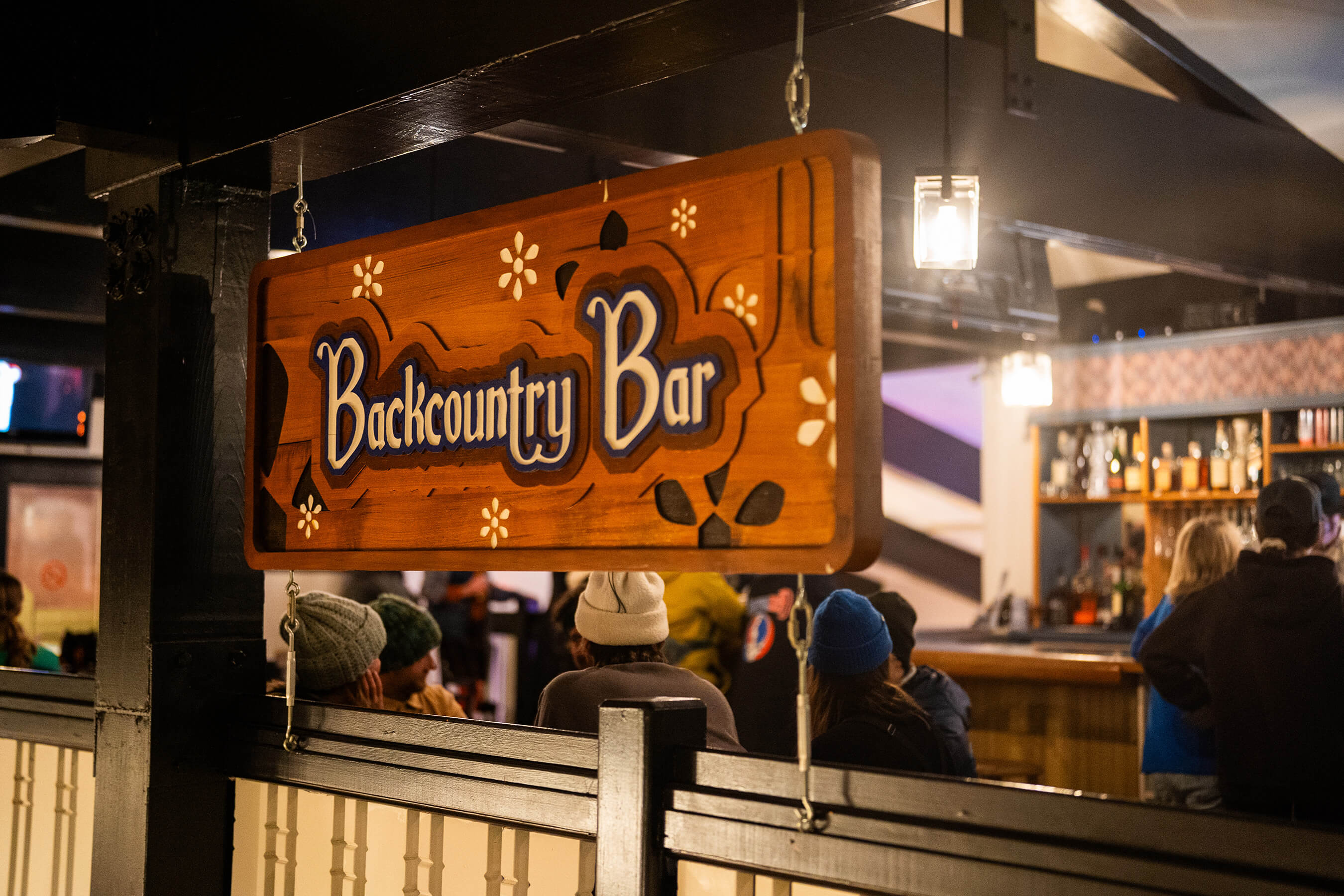 Picture of Backcountry Bar Sign above bar railing