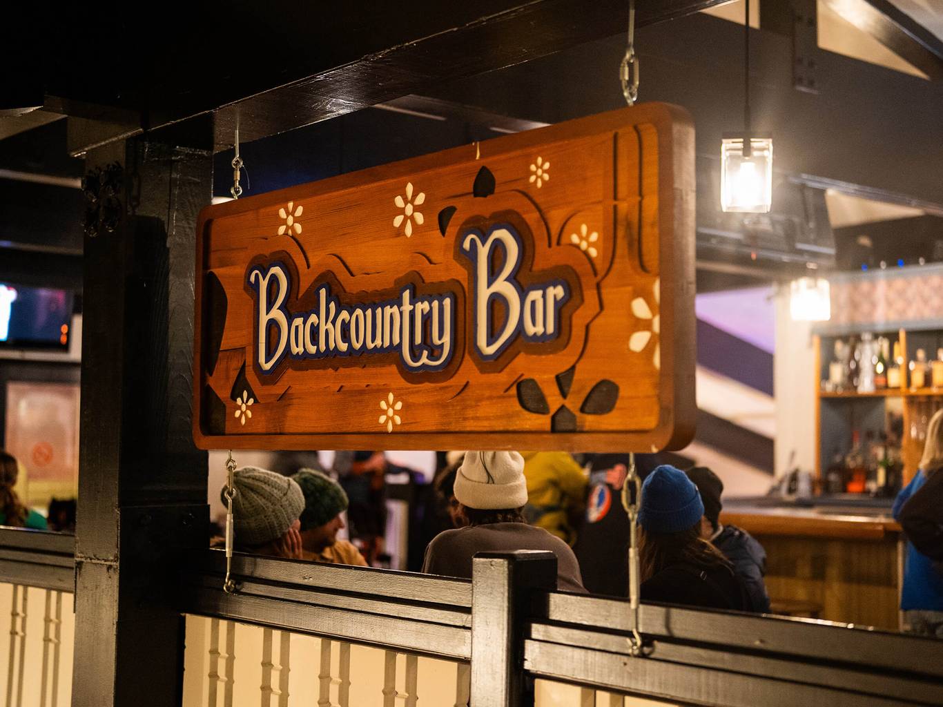 Picture of Backcountry Bar Sign above bar railing