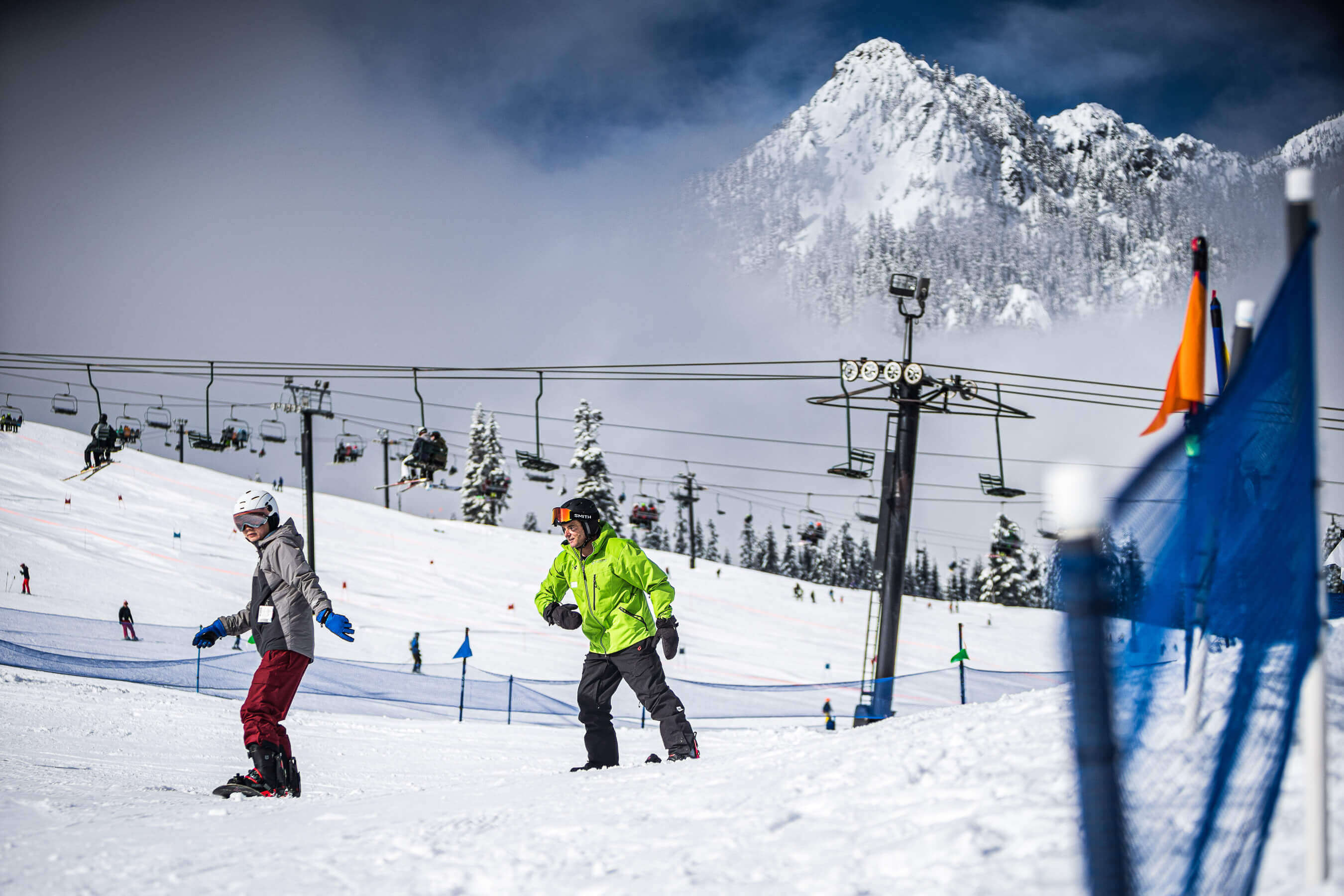 snowboarder learning to ride with instructor