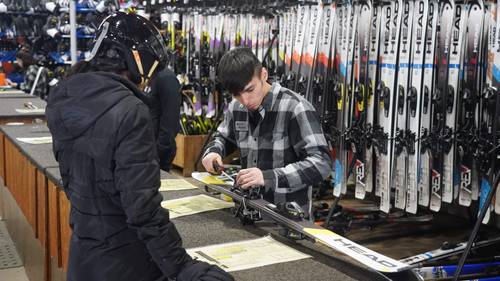 rental tech with a guest in the rental shop