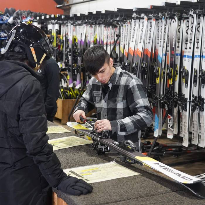 rental tech with guest in rental shop