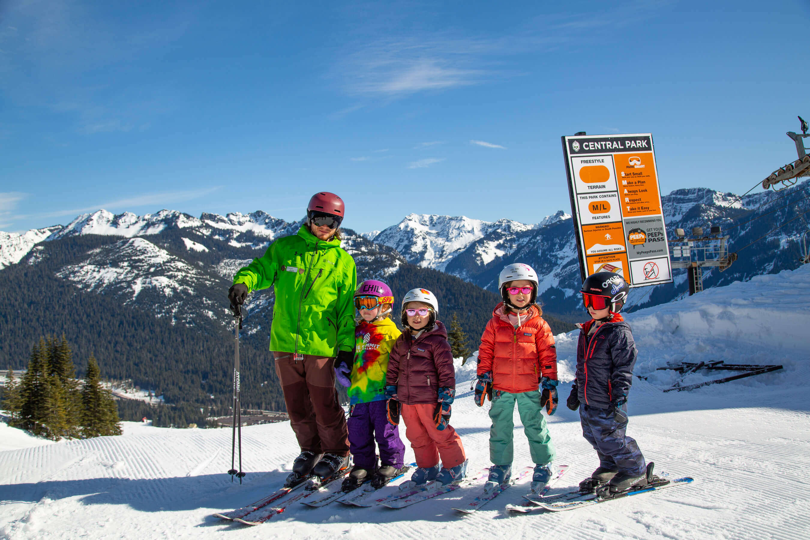 instructor with kids waiting to ski