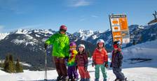 instructor with kids waiting to ski