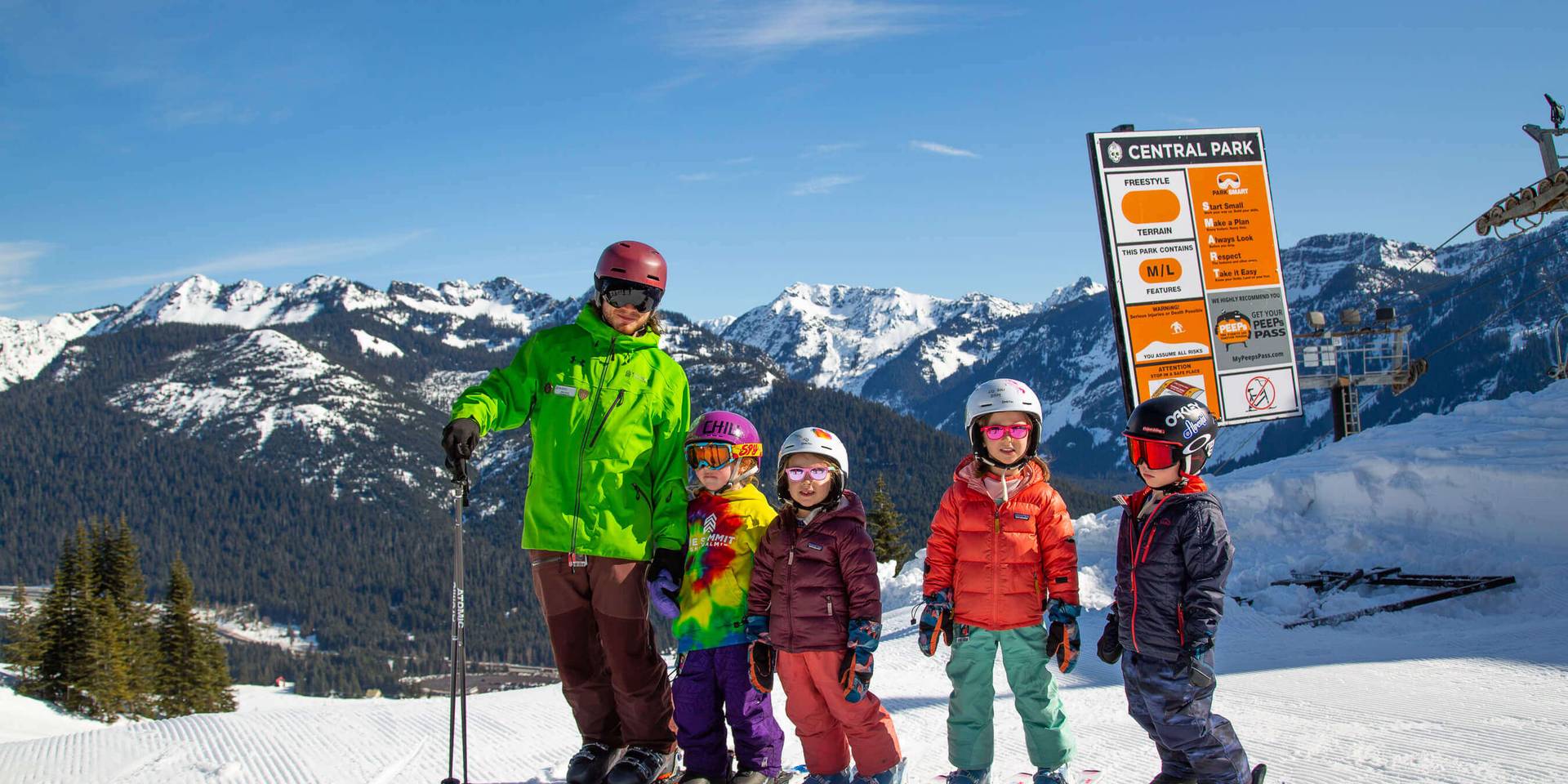 instructor with kids waiting to ski