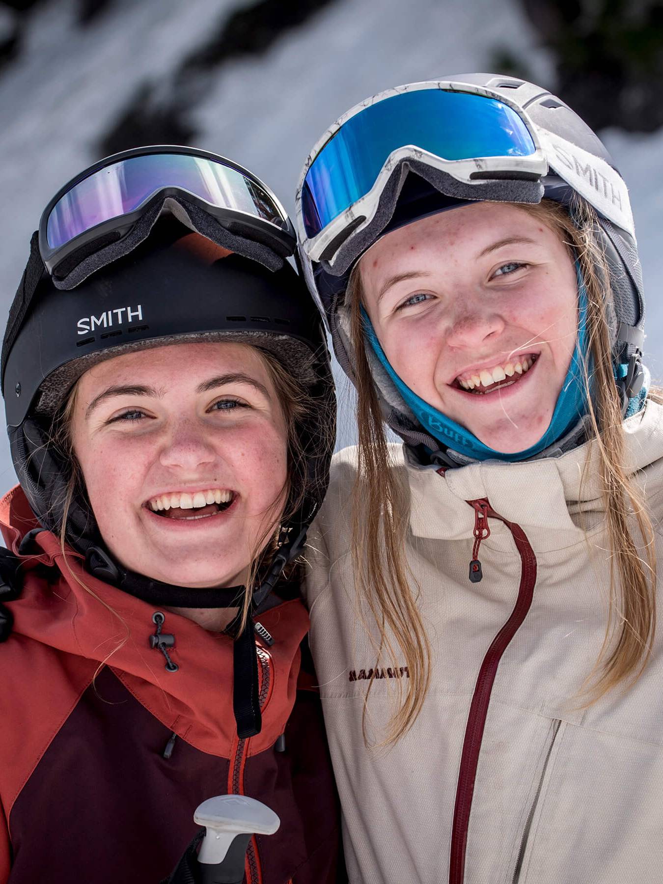 two girls smiling together