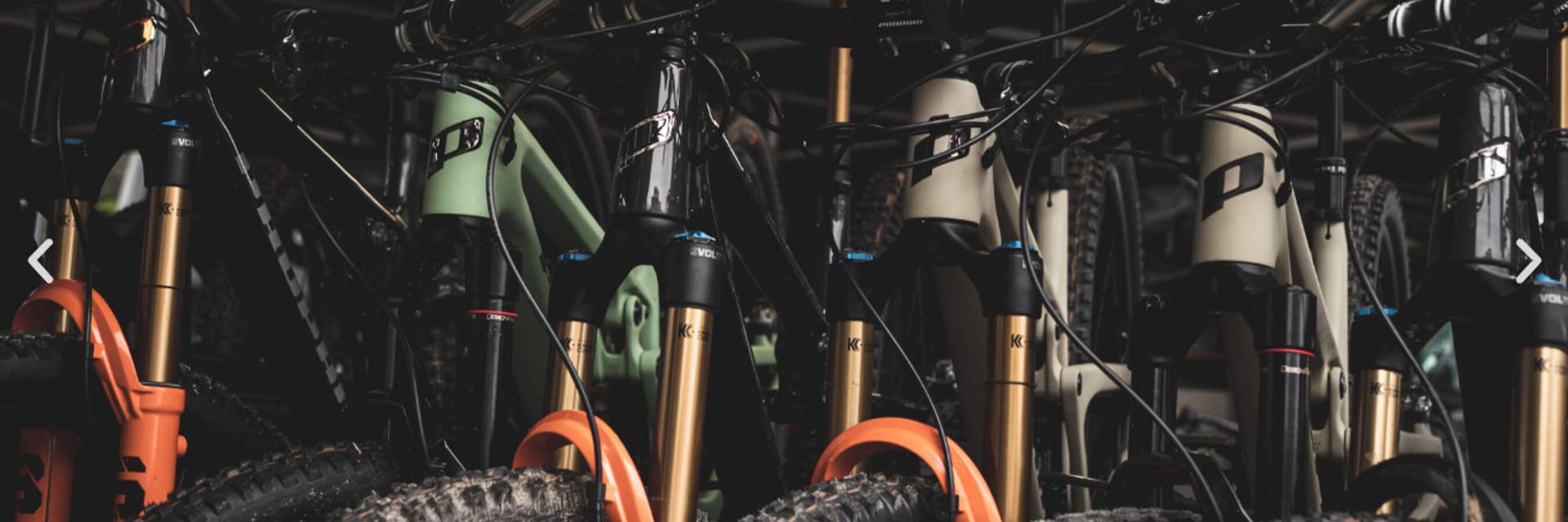 Propain bikes lined up waiting for demo event