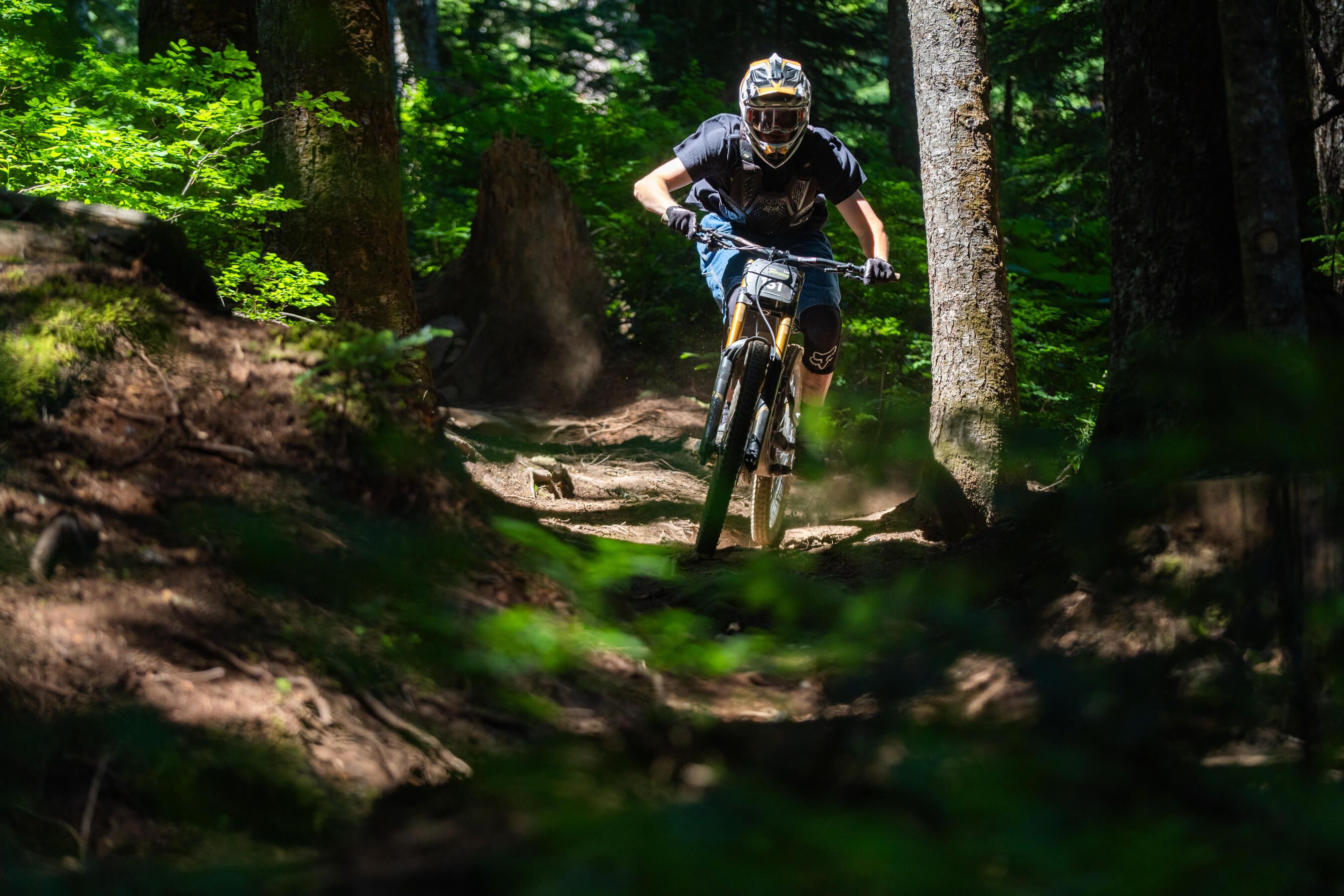 Speed Series racer pedals hard down trail