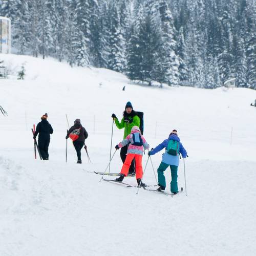 kids cross country skiing with instructor