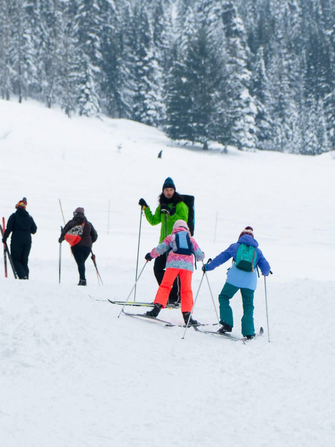 kids cross country skiing with instructor
