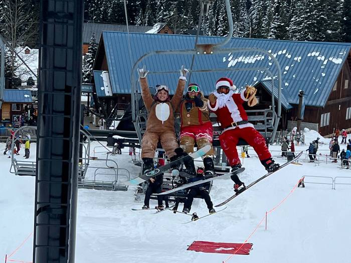 santa and holiday friends on chairlift