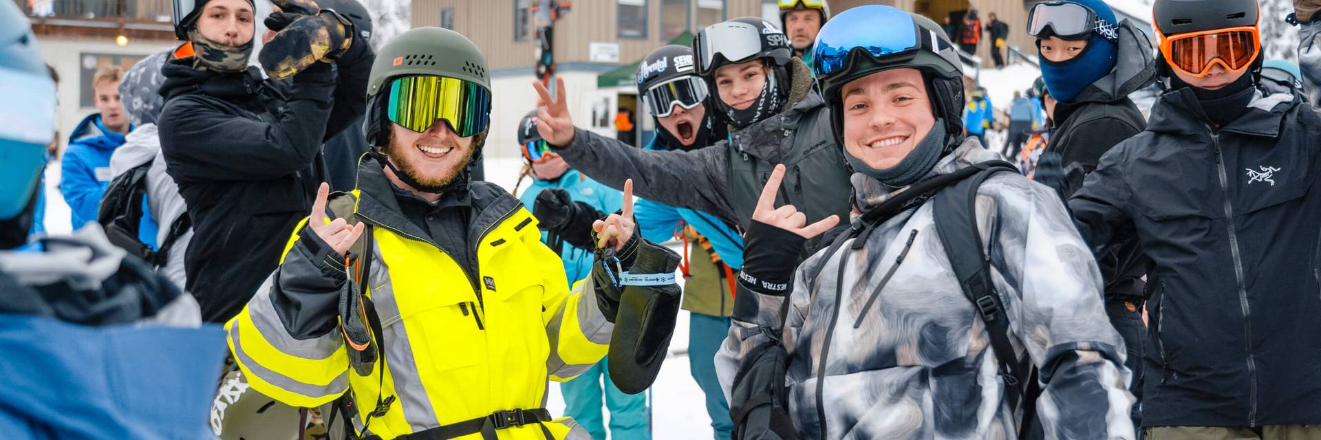 Group of skiers smiling in lift line
