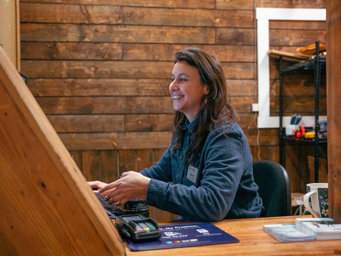 guest services staff smiling
