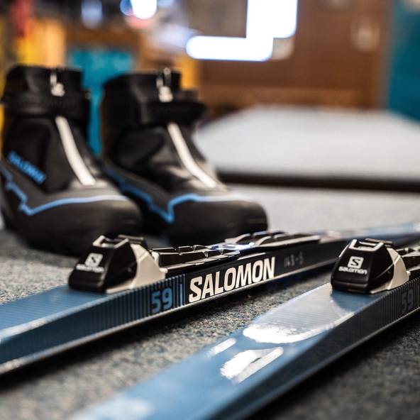 nordic boots and skis on the counter