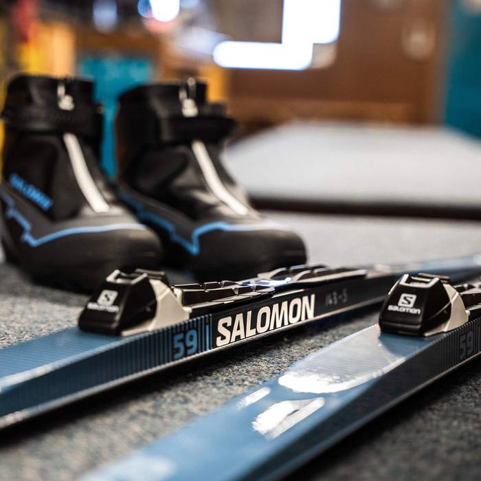 nordic skis and boots on a counter