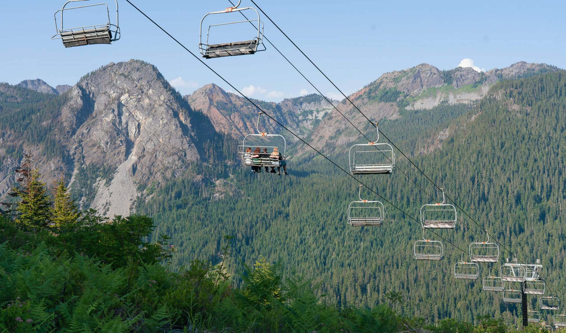 view of mountains and chairlift in the summer