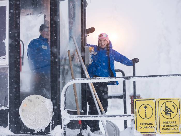 Lift operating smiling and waving