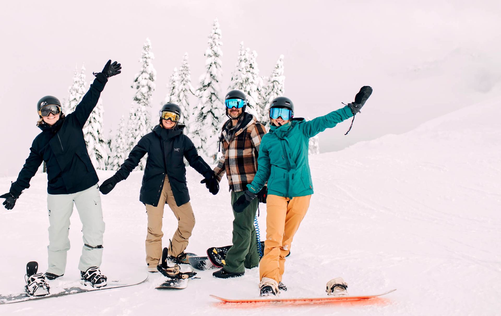 group of snowboarders posing for the camera
