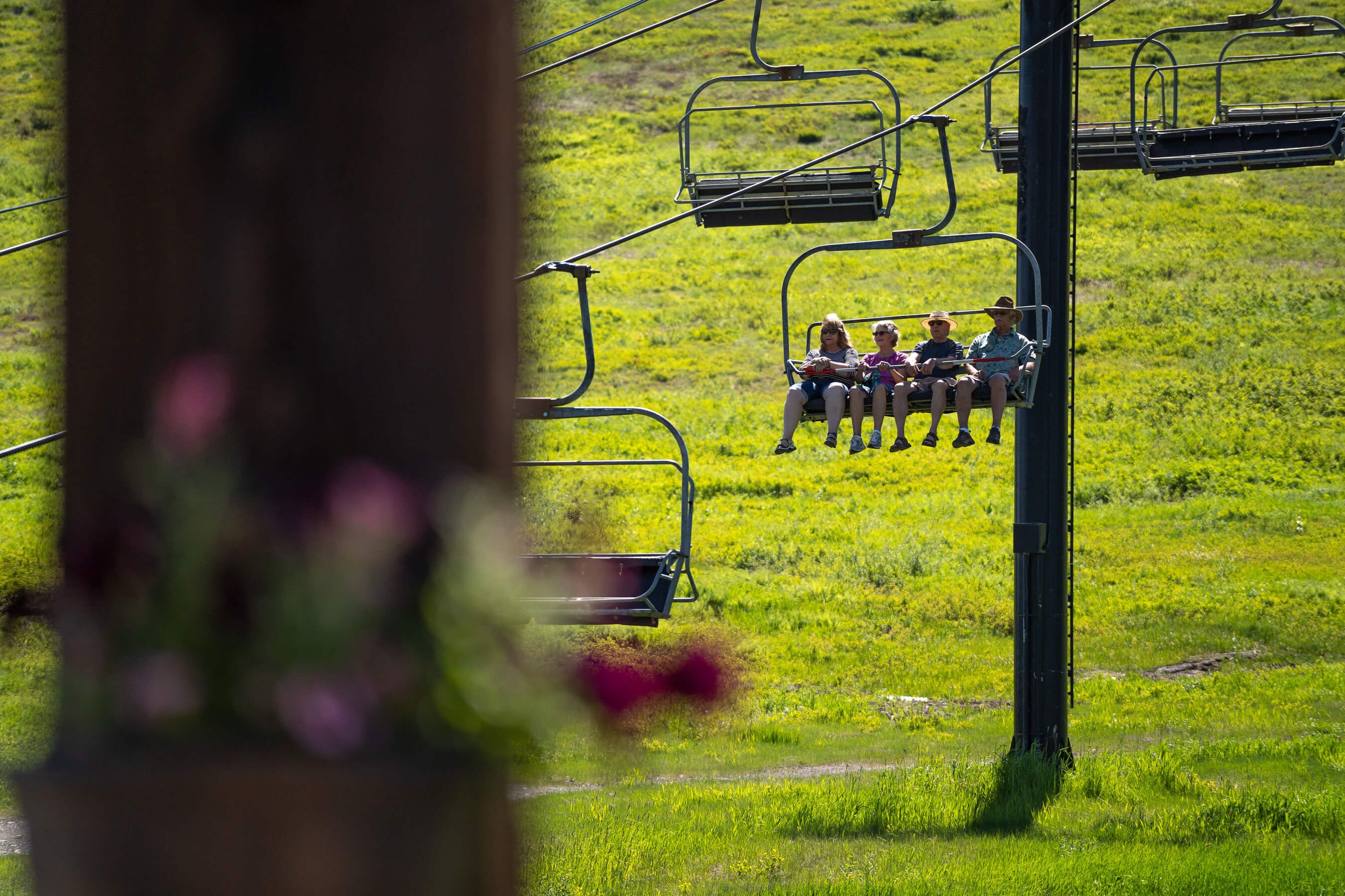 group on chairlift in the summer