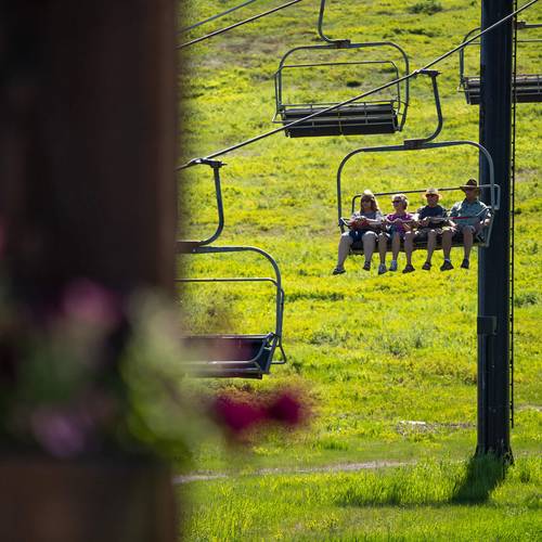 group on chairlift in the summer