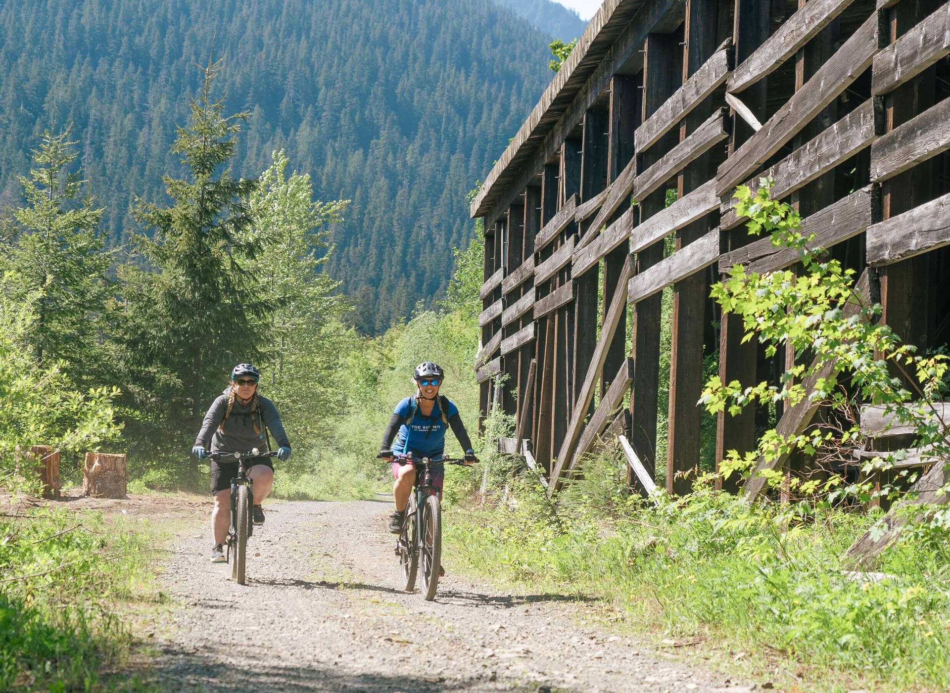two women riding bikes down the Palouse to Cascades trail
