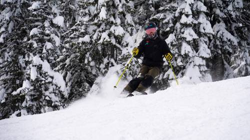 skier on groomer