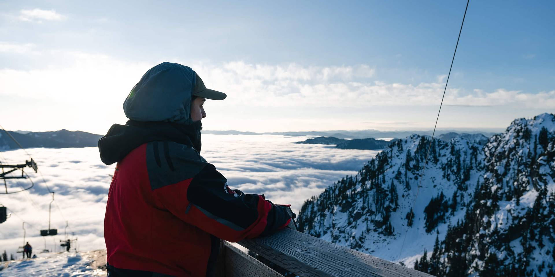 Patroller at the top of the mountain gazing at the view