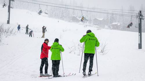 nordic ski instructors with student