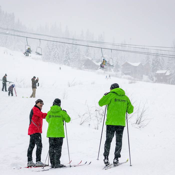 nordic ski instructors with student