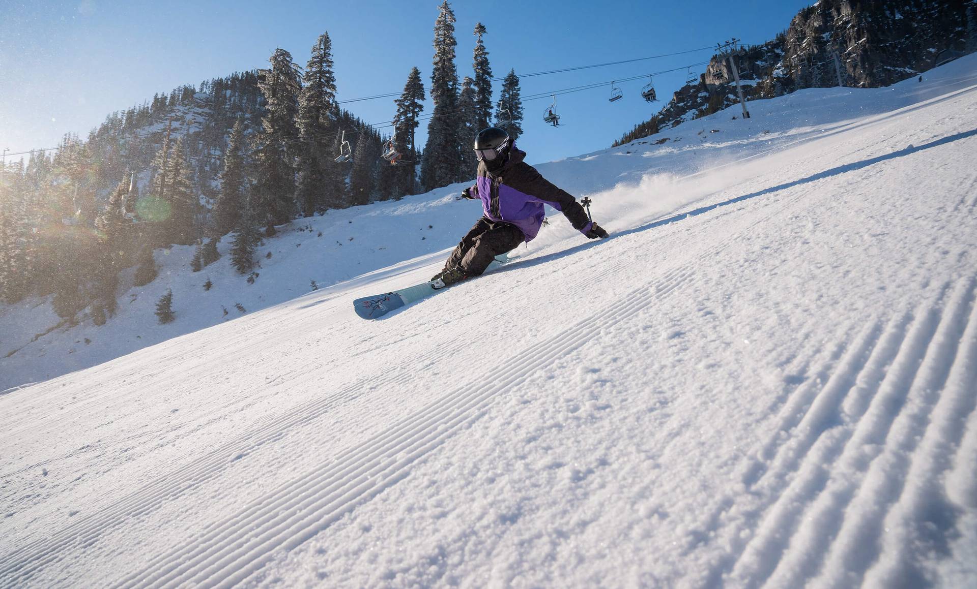 skier on a crispy groomer