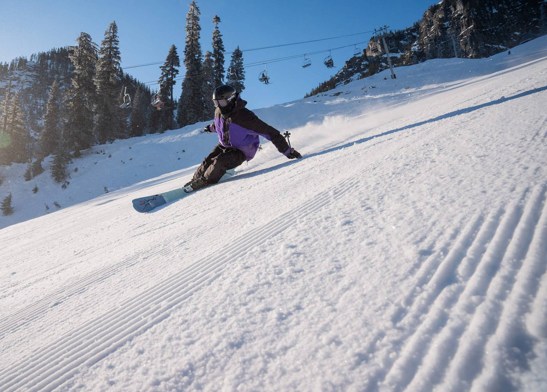 skier on a crispy groomer