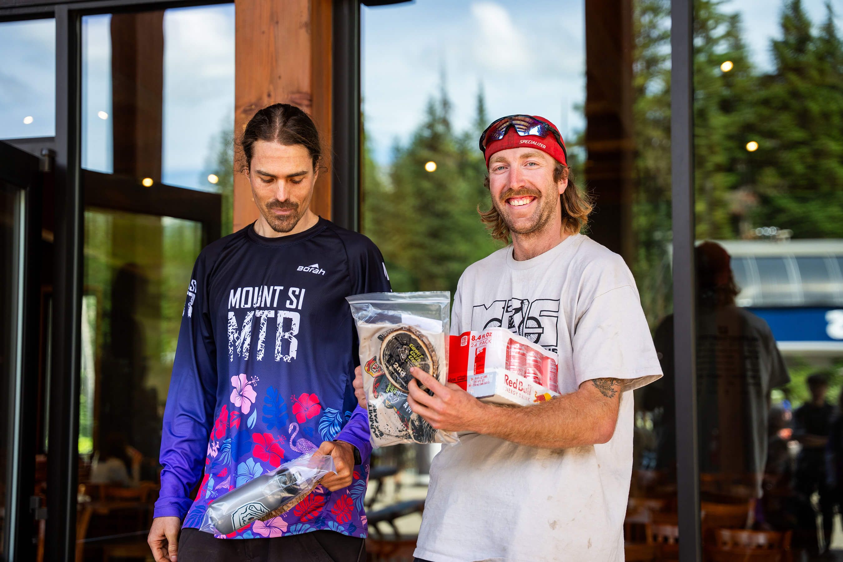 two men smiling with their prizes from summit speed series