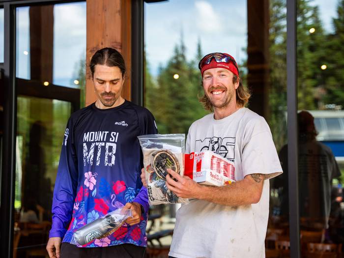 two men smiling with their prizes from summit speed series