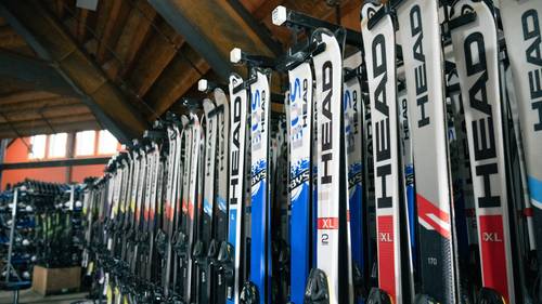 rental skis on a rack