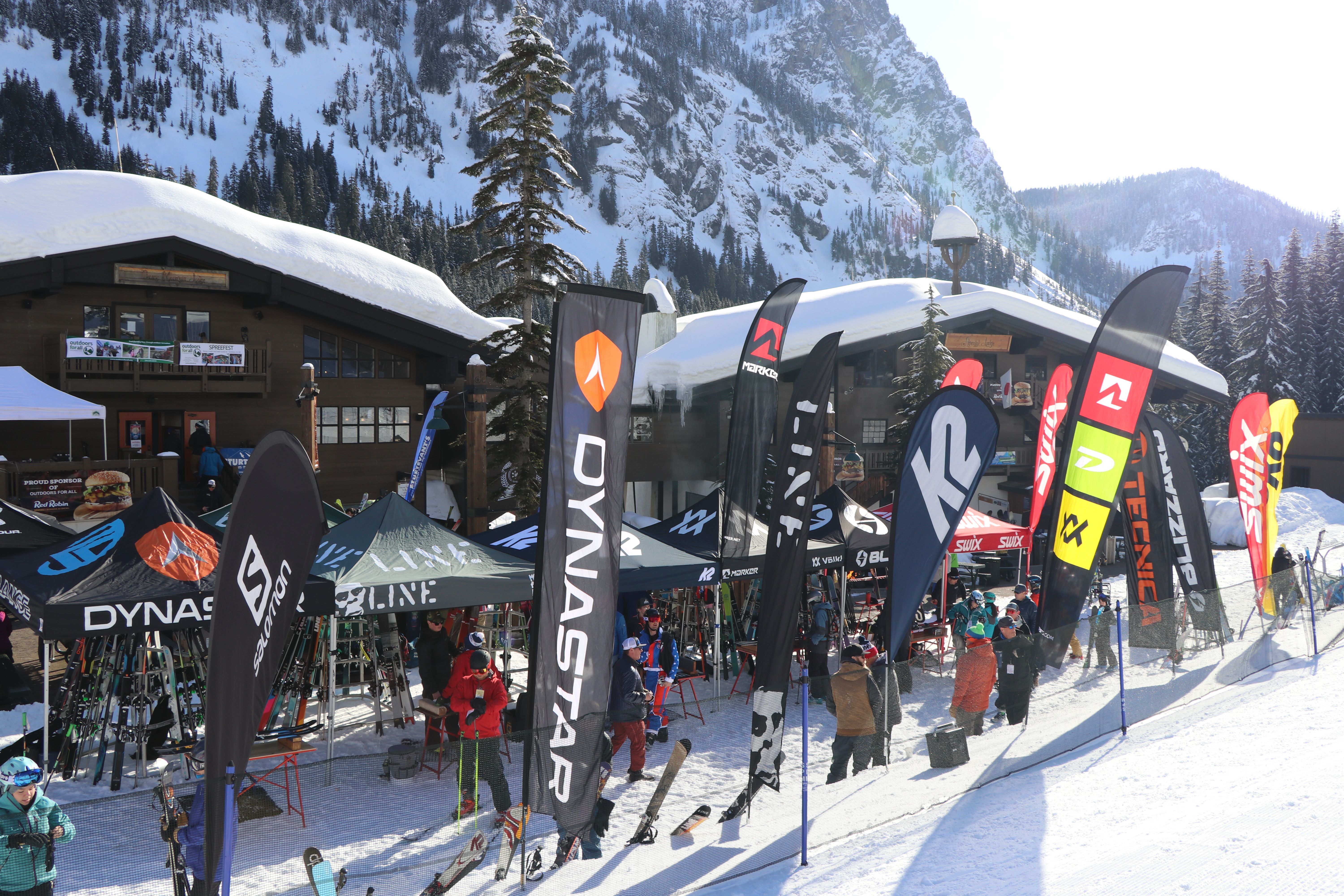 Spreefest vendor village demo booths set up on snow in front of lodges at Alpental.