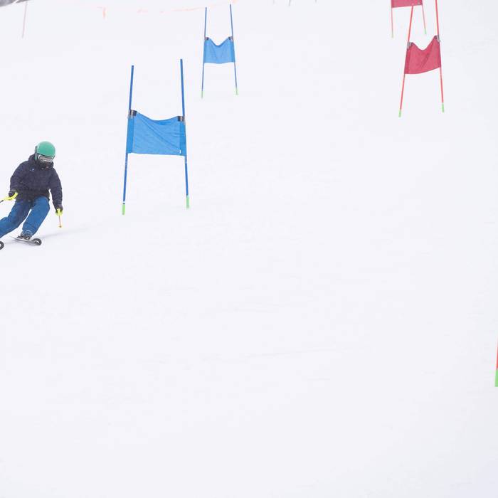 Kid racing between gates