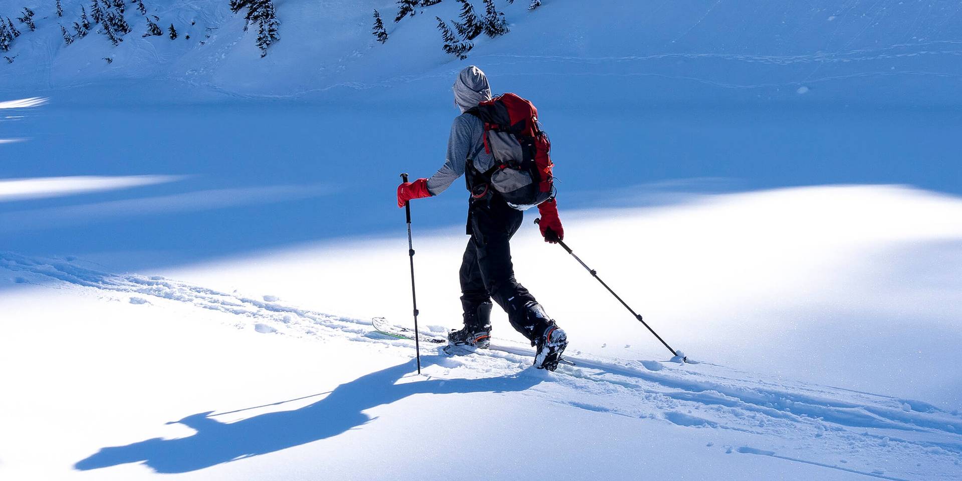 splitboarder touring on flats