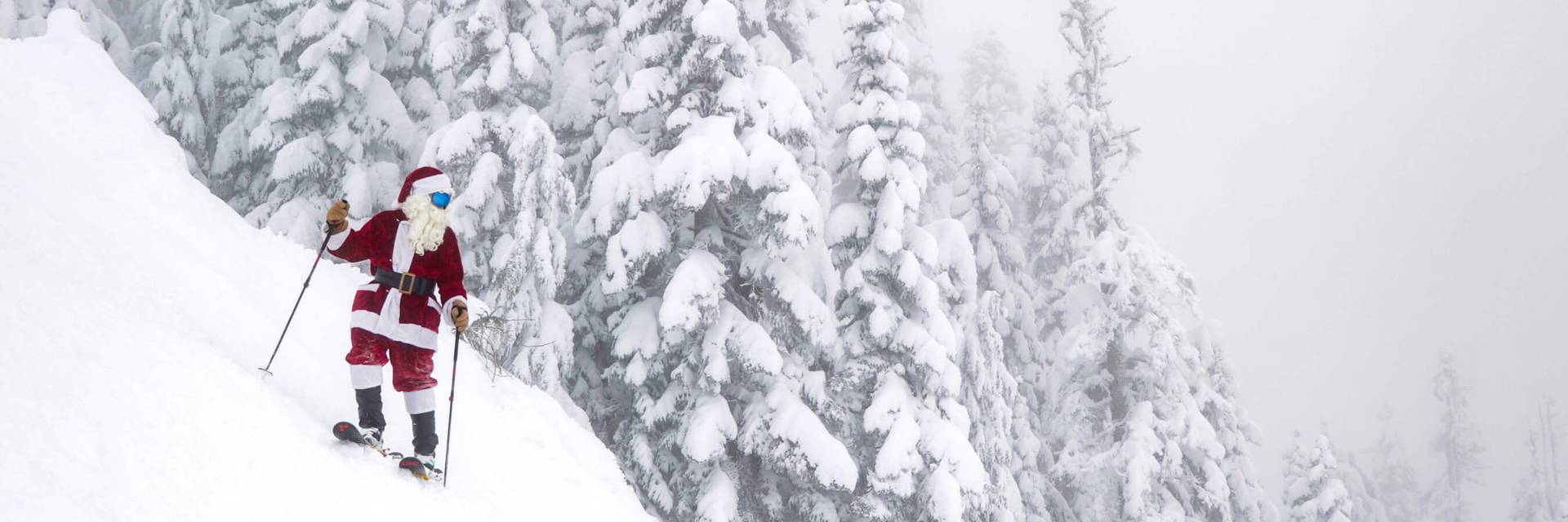 santa on skis stopped on steep slope