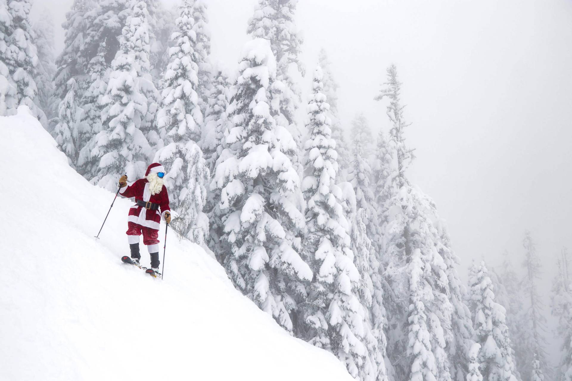 Skier dressed as Santa navigates steep terrain