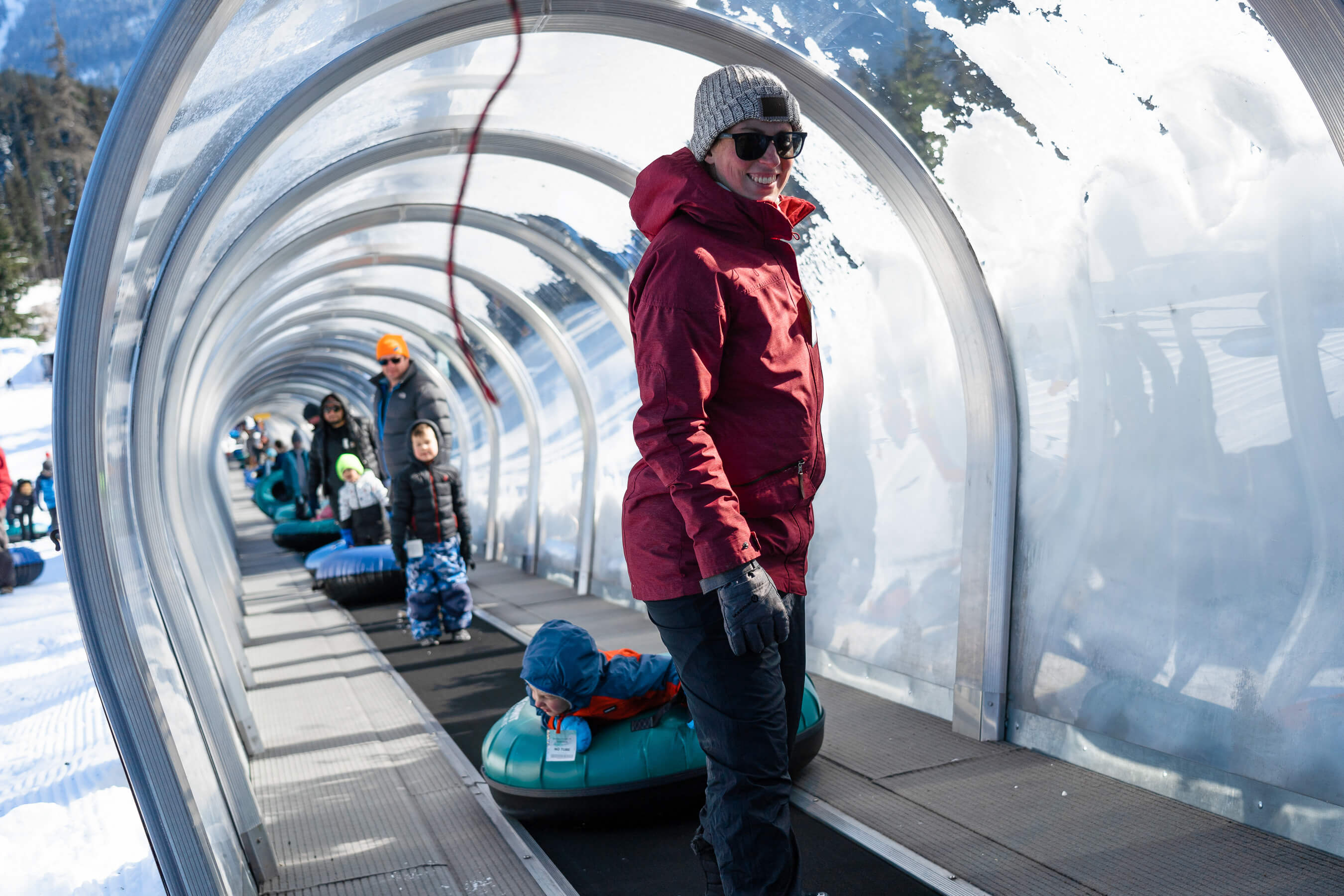 People in tubing conveyor lift