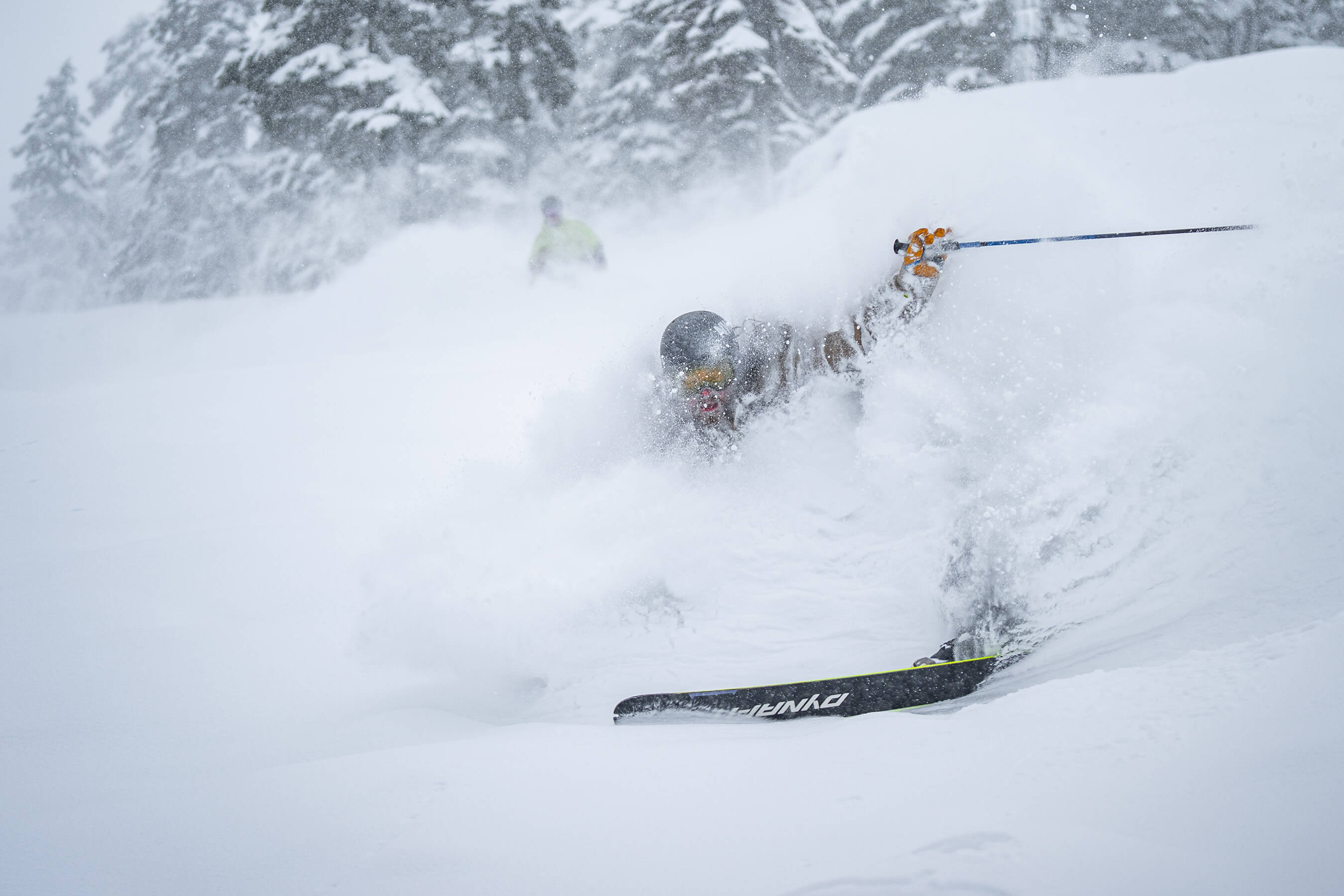 skier slashing powder