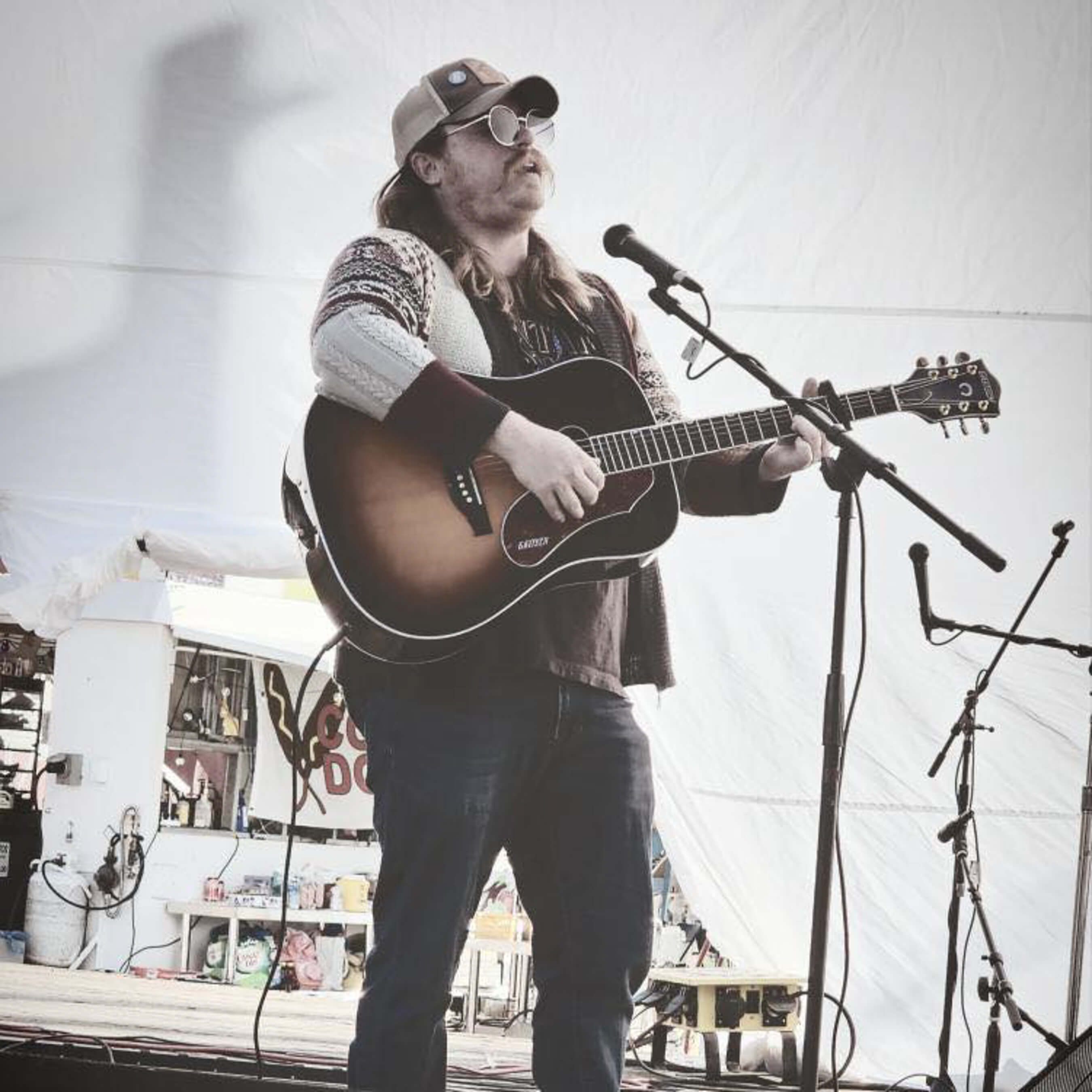Cascade Cody musician with guitar on stage