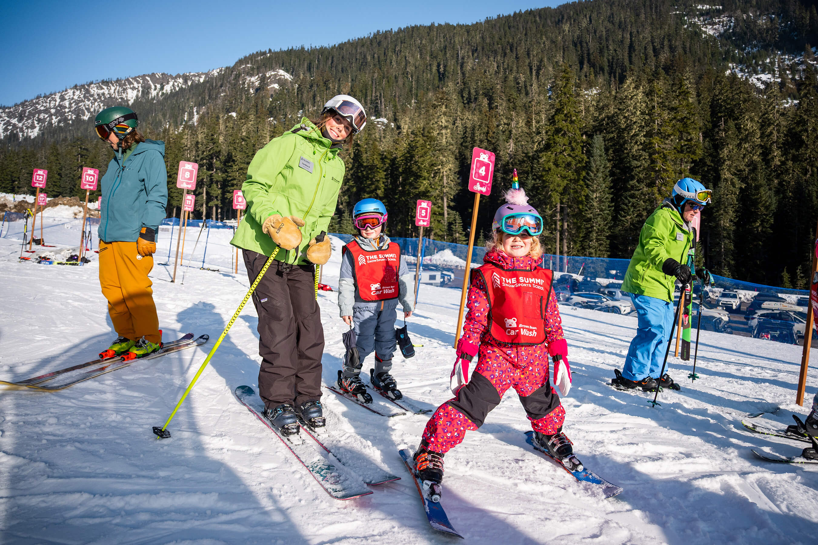 summit leadership student with ski school students