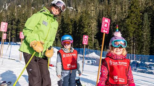 summit leadership student with ski school students