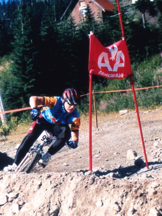 world cup mountain biker turning on a berm