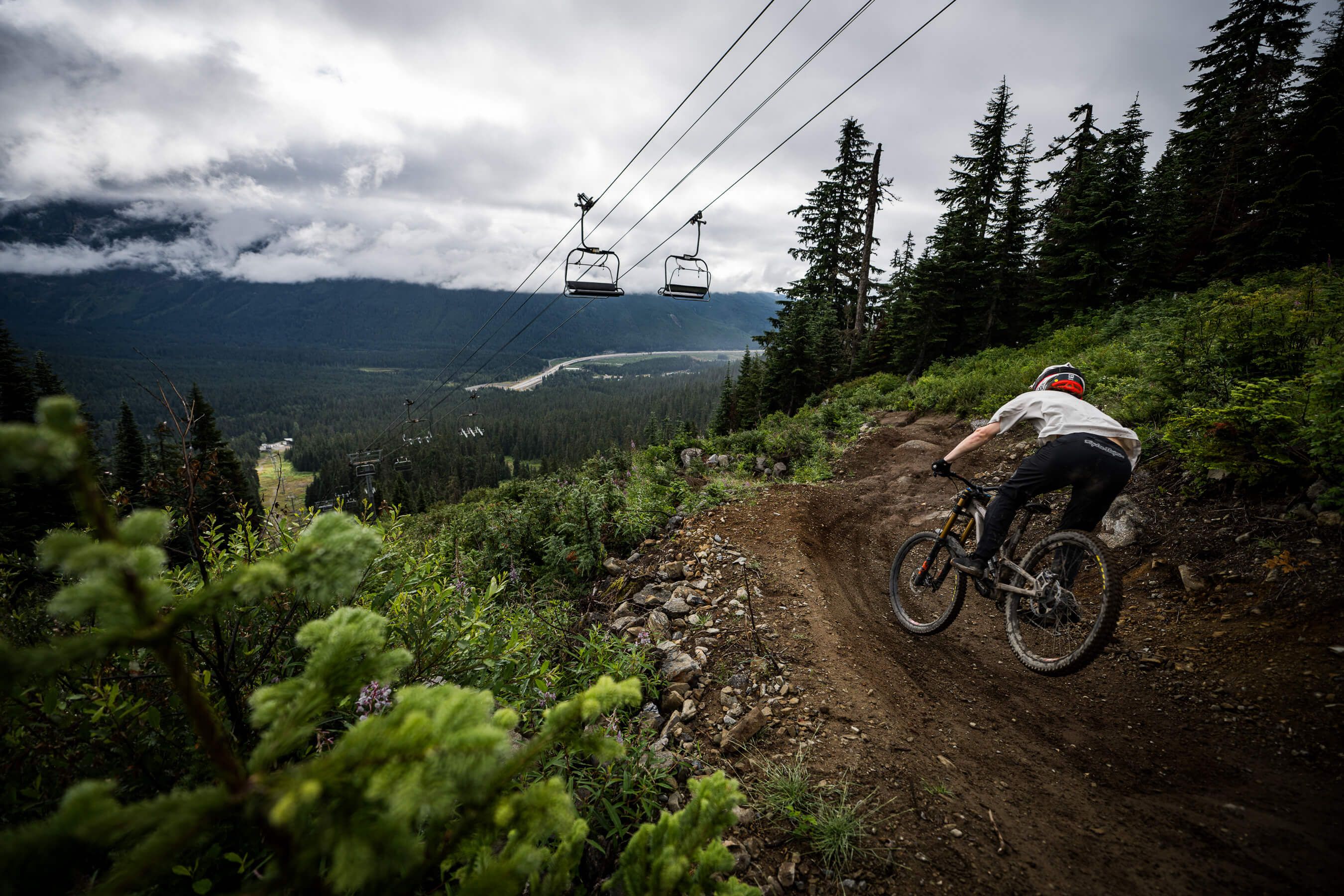biker on trail under chairlift