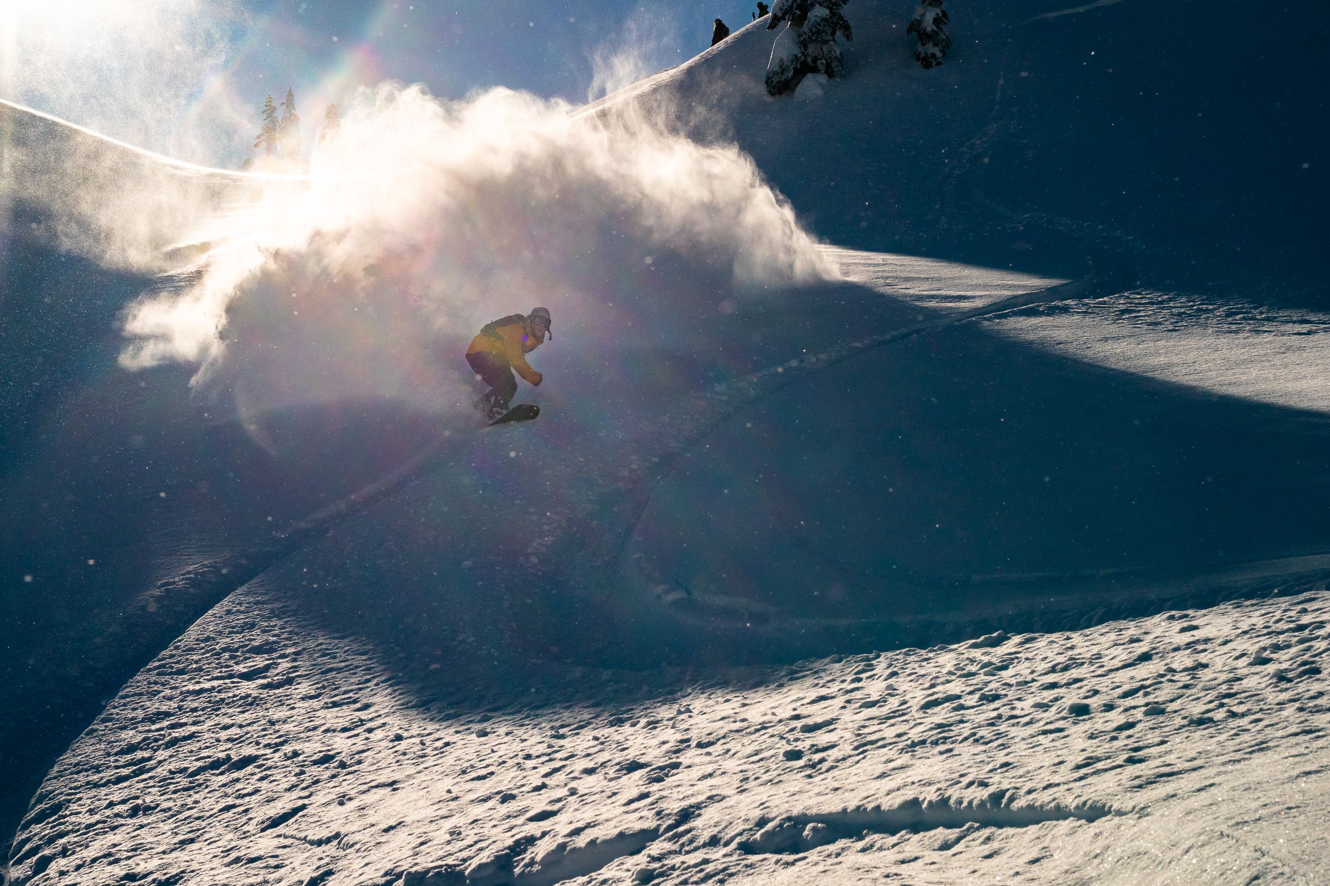snowboarder powder slash sunburst