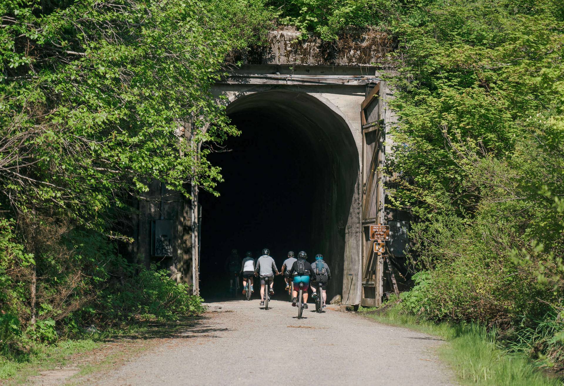 group biking through Snoqualmie Tunnel